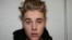 Canadian pop singer Justin Bieber is pictured in police custody in Miami Beach, Florida January 23, 2014 in this Miami Beach Police Department handout released to Reuters on March 4, 2014.