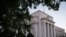 FILE - The Federal Reserve headquarters in Washington.
