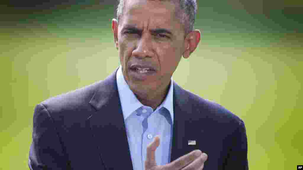 This Aug. 9, 2014, photo shows President Barack Obama as he speaks on the South Lawn of the White House in Washington, about the ongoing situation in Iraq. 