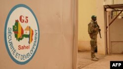 FILE - A Malian Army soldier with the G5 Sahel is seen in Sevare, May 30, 2018.