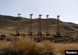 FILE - Equipment and machines installed by Chinese excavators are seen near a copper mine in Mes Aynak, Logar province, Afghanistan, Feb. 14, 2015.