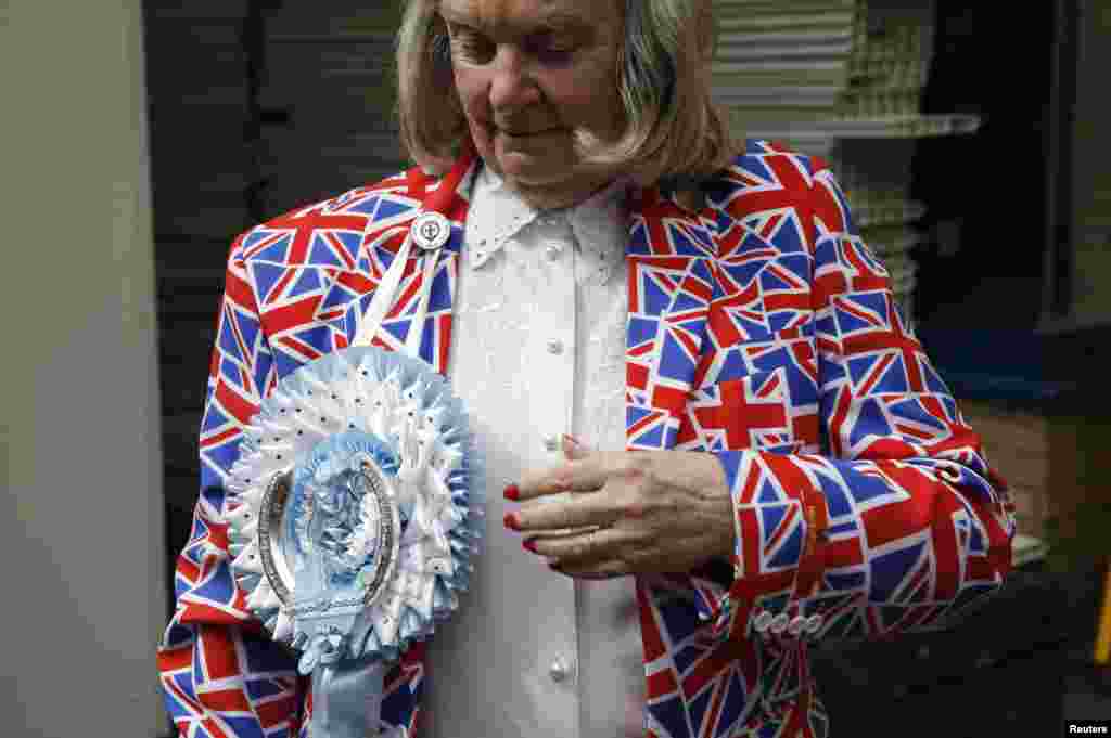 A fan of the royal family wears a union flag-themed blazer outside the Lindo Wing of St. Mary's hospital in London. Britain's Catherine, Duchess of Cambridge, is due to give birth to her second child at the hospital some time in the next two weeks. 