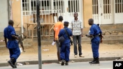 FILE - Police arrest a man in Bujumbura, Burundi, Feb. 3, 2016. Widespread rights violations and repressive measures in the country are hidden behind a façade of democracy, U.N. investigators have found.