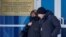 FILE - Lyudmila Navalnaya, the mother of late Russian opposition leader Alexei Navalny, and his lawyer Alexei Tsvetkov walk out of an office of the Investigative Committee's regional department in the city of Salekhard in the Yamal-Nenets Region, Russia, Feb. 19, 2024.