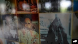 FILE - Photos of Haile Selassie I hang on the walls of the Ras Freeman Foundation for the Unification of Rastafari tabernacle on Saturday, May 13, 2023, in Liberta, Antigua.