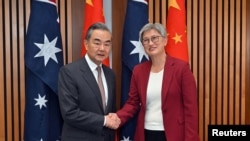 China’s Foreign Minister Wang Yi meets with Australia's Foreign Affairs Minister Penny Wong at Parliament House, in Canberra, March 20, 2024. 