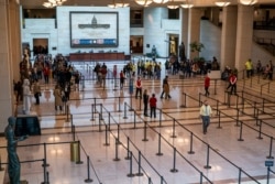 Tourists queue up at the U.S. Capitol Visitor Center, in Washington, March 11, 2020.