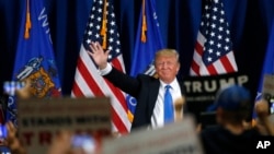 Republican presidential candidate, Donald Trump, arrives for a rally at Nathan Hale High School in West Allis, Wissonsin, April 3, 2016.