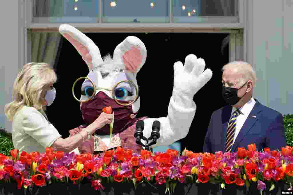 U.S. President Joe Biden,&#160;first lady Jill Biden and a person wearing an Easter Bunny costume are see on the Blue Room Balcony of the White House in Washington.