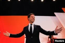 Dutch Prime Minister Mark Rutte of the VVD Liberal party appears before his supporters in The Hague, Netherlands, March 15, 2017. Rutte is poised for a third term.