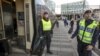 FILE - Police check a train at the Swedish end of the bridge between Sweden and Denmark, in Hyllie district, Malmo, Nov. 12, 2015. Sweden tightened its borders in 2015, and has further restricted its migration policy after the September 2022 election of a new government.