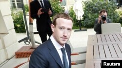 FILE - Facebook's founder and CEO Mark Zuckerberg meets with French President Emmanuel Macron at the Elysee Palace after the "Tech for Good" summit, in Paris, France, May 23, 2018.