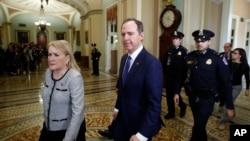 House Democratic impeachment managers, Rep. Adam Schiff and Rep. Sylvia Garcia walk to the Senate chamber for the impeachment trial of President Donald Trump at the Capitol, Jan 31, 2020,