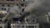 FILE - Houses are engulfed in fire as the Israeli army raided the northern West Bank town of Qabatiya, Sept. 19, 2024. 