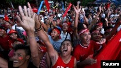 FILE - Supporters of Myanmar's pro-democracy figurehead Aung San Suu Kyi gather outside National League for Democracy headquarters (NLD) in Yangon, Myanmar, Nov. 9, 2015. 