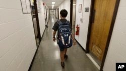 Jeremy Shuler, 12, a freshman at Cornell University, walks to meet an adviser on campus in Ithaca, New York, Aug. 26, 2016. He’s the youngest student on record to attend the Ivy League school. 