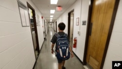 Jeremy Shuler, 12, a freshman at Cornell University, walks to meet an adviser on campus in Ithaca, New York, Aug. 26, 2016. He’s the youngest student on record to attend the Ivy League school.