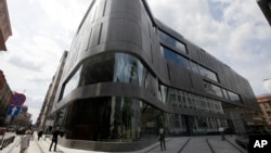 FILE - One of the latest additions to Poland’s growing luxury goods market, the Wolf Bracka department store, beckons shoppers in the heart of the Polish capital, in Warsaw. A new Polish law banning almost all trade on Sundays has taken effect on March 11, 2018, with large supermarkets and most other retailers closed.