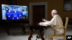 Pope Francis speaks to the crew aboard the International Space Station from the Vatican, Thursday, Oct. 26, 2017. Pope Francis' hookup Thursday marks the second papal phone call to space: Pope Benedict XVI rang the space station in 2011.(L'Osservatore Rom