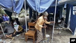 An elderly woman at a temporary shelter for people displaced by Mount Merapi eruption in Umbulharjo, Yogyakarta, Indonesia, 27 Oct 2010