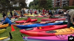 Activists who oppose Royal Dutch Shell's plans to drill for oil in the Arctic Ocean prepare their kayaks for a protest in Seattle's Elliott Bay, May 16, 2015.