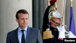French President Emmanuel Macron waits for guests to leave at the Elysee Palace in Paris, France, June 6, 2017. 