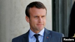 French President Emmanuel Macron waits for guests to leave at the Elysee Palace in Paris, France, June 6, 2017. 