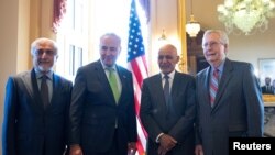 From left, Afghan reconciation chief Abdullah Abdullah, U.S. Senate Majority Leader Chuck Schumer, Afghan President Ashraf Ghani, and U.S. Senate Minority Leader Mitch McConnell, pose for a photo on Capitol Hill in Washington, June 24, 2021. 
