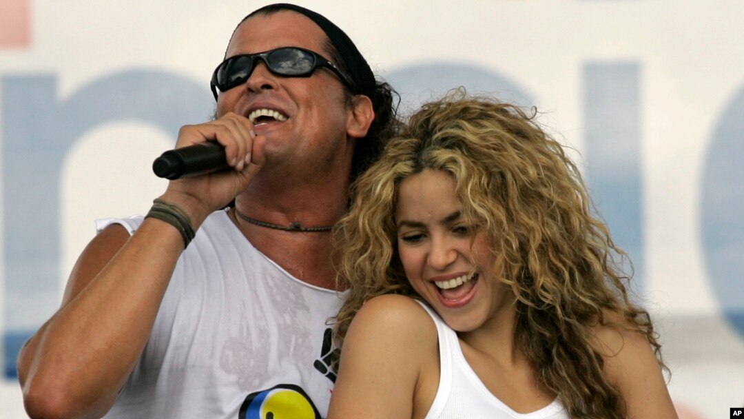 FILE - Colombian singers Shakira, right, and Carlos Vives perform during a "concert for peace" Independence Day celebrations in Leticia, Colombia. 