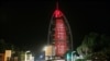 FILE - A sign reading "UAE Chinese Week" in Chinese and Arabic is projected onto the Bus Al Arab luxury hotel to celebrate the UAE Chinese Week in Dubai, July 18, 2018.