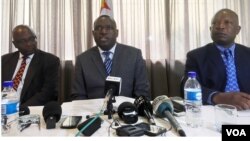 FILE: Zimbabwe's new Foreign Minister, Sibusiso Moyo (center), addresses diplomats and the media in Harare, Zimbabwe, Dec. 2017. (S. Mhofu/December 2017)