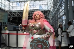 A cosplayer poses for a photo during the second day of New York Comic Con, Friday, Oct. 4, 2019, in New York. (AP Photo/Steve Luciano)