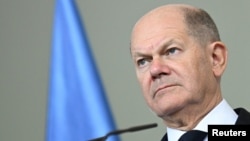 FILE - German Chancellor Olaf Scholz reacts at a media briefing at the Chancellery in Berlin, Nov. 5, 2024.