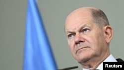 German Chancellor Olaf Scholz reacts at a media briefing following his bilateral talks with Somali's President Hassan Sheikh Mohamud at the Chancellery in Berlin, Nov. 5, 2024. 