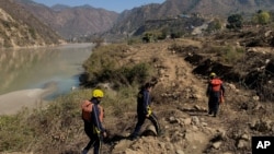 Rescuers arrive to search for bodies in the downstream of Alaknanda River in Rudraprayag, northern state of Uttarakhand, India, Monday, Feb.8, 2021. More than 2,000 members of the military, paramilitary groups and police have been taking part in…