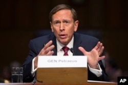 FILE - Former CIA Director David Petraeus testifies on Capitol Hill in Washington before the Senate Armed Services Committee hearing on Middle East policy, Sept. 22, 2015.