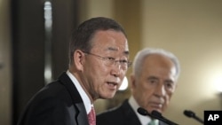 U.N. Secretary-General Ban Ki-moon addresses the media next to Israel's President Shimon Peres in Jerusalem, February 1, 2012.