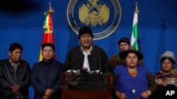 Bolivia's President Evo Morales, center, speaks during a press conference at the military base in El Alto, Bolivia, Nov. 10, 2019.