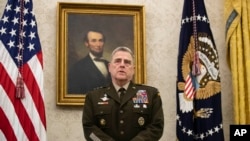 FILE - Joint Chiefs Chairman Gen. Mark Milley speaks during the presentation of the Space Force Flag in the Oval Office of the White House with President Donald Trump, May 15, 2020, in Washington.