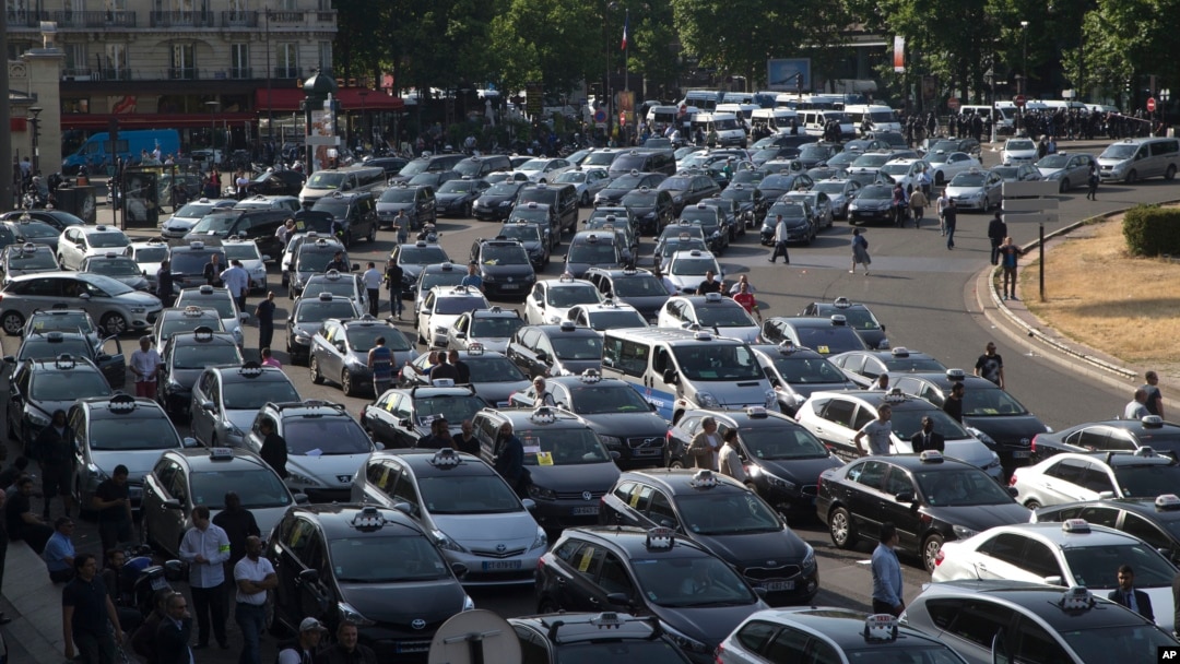 Taxis gather at a major entrance to Paris, France, June 25, 2015.