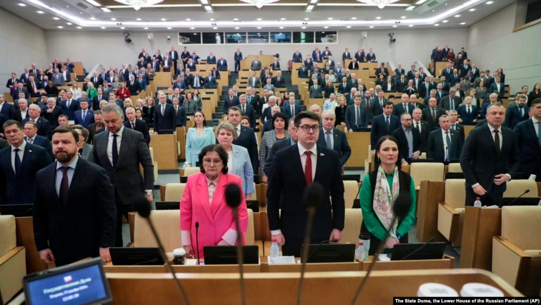 Russian lawmakers listen to the national anthem prior to a session at the State Duma, the lower house of the Russian Parliament in Moscow, Russia, Dec. 17, 2024.