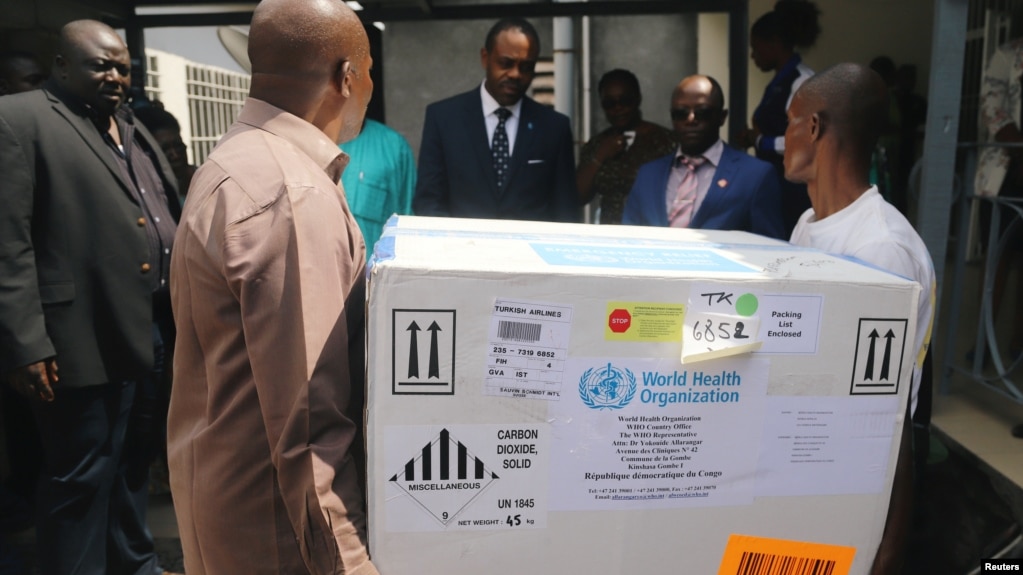 Congolese Health Ministry officials help deliver the first batch of experimental Ebola vaccines in Kinshasa, Democratic Republic of Congo, May 16, 2018.