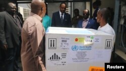 Congolese Health Ministry officials help deliver the first batch of experimental Ebola vaccines in Kinshasa, Democratic Republic of Congo, May 16, 2018. 