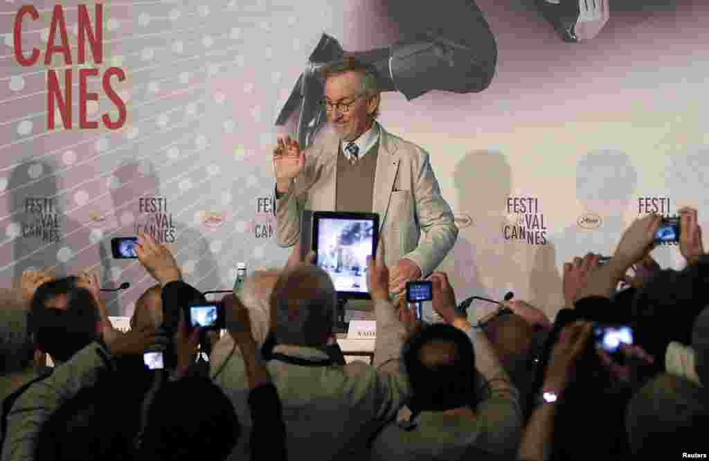 Journalists take pictures as director Steven Spielberg, Jury President of the 66th Cannes Film Festival, arrives to attend a news conference before the opening of the 66th Cannes Film Festival in Cannes, France. 