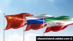 Flags of China, Russia and Iran.