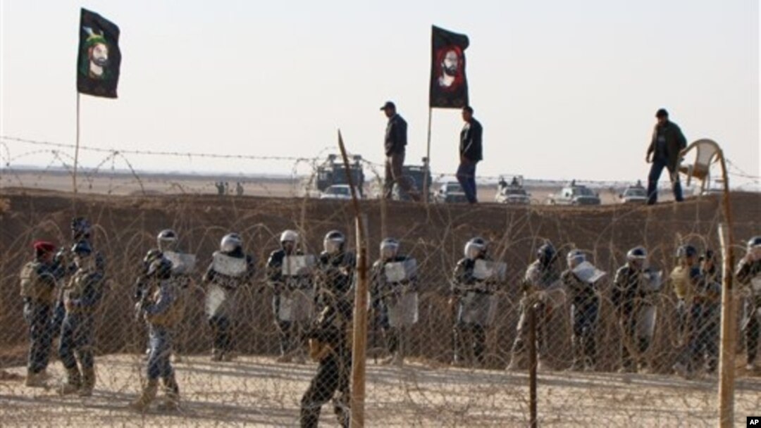 Pasukan keamanan Irak menjaga ketat kamp pengungsi Ashra di Baghdad, yang menampung anggota Organisasi Mujahedeen Rakyat, kelompok oposisi Iran (foto: dok).