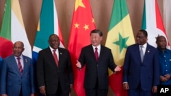 FILE - President of China Xi Jinping, center, and South African President Cyril Ramaphosa, second left, attend the China-Africa Leaders' Roundtable Dialogue on the last day of the BRICS Summit, in Johannesburg, South Africa, August 24, 2023.