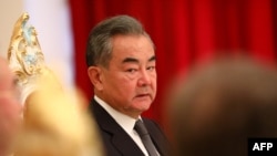 FILE - This handout picture released by the Russian foreign minister's office on July 14, 2021, shows Chinese Foreign Minister Wang Yi attending a Shanghai Cooperation Organization meeting.