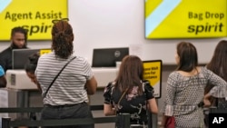 FILE - Passengers hold   successful  a enactment     for assistance   astatine  the Spirit Airlines summons  antagonistic  astatine  the Tampa International Airport, June 1, 2023, successful  Tampa, Fla.