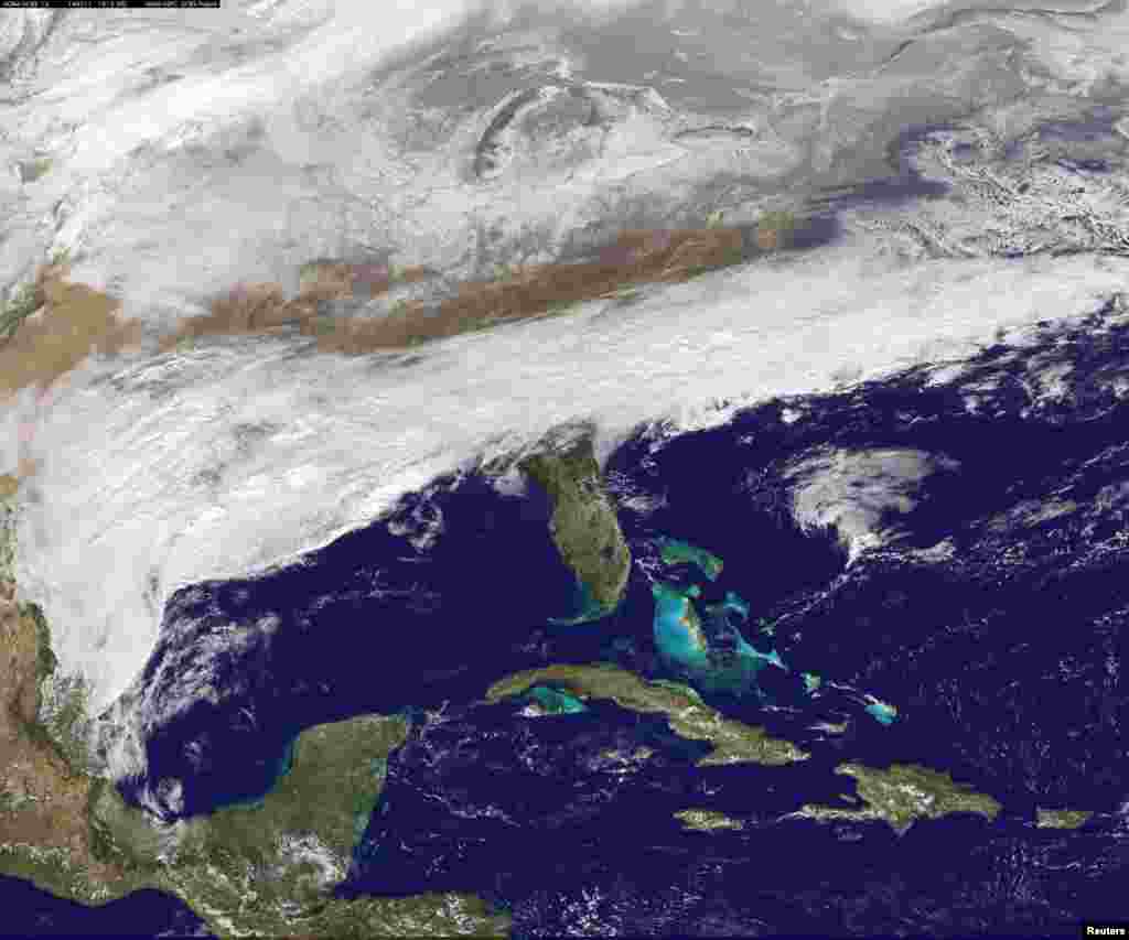 Clouds are bringing wintry precipitation and chilly temperatures to the U.S. South as seen in this image from NOAA&#39;s satellite taken on Feb. 11, 2014.&nbsp;